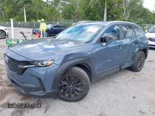 2024 Mazda CX-50 S Select z VIN 7MMVABAMXRN191832, wystawiony jako IAAI lot #41946922 z przebiegiem 15 850 mil mil oraz . Historia ofert i sprzedaży dostępna na DreamBid. Obrazek 2.