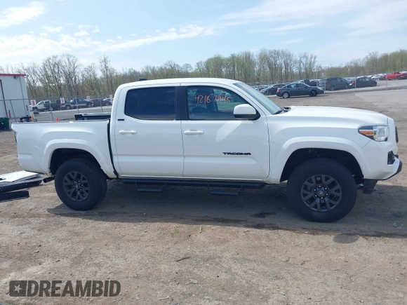2023 Toyota Tacoma SR with VIN 3TMCZ5AN2PM642205, listed as a IAAI auction lot 42167945 with 10,595 mi miles and . Bid and sale history available at DreamBid. Image 14.