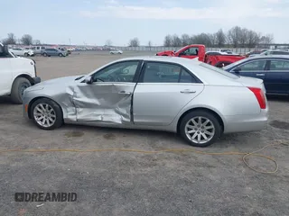 2014 Cadillac CTS Luxury AWD z VIN 1G6AX5SX2E0196881, wystawiony jako IAAI lot #41707633 z przebiegiem 169 168 mil mil oraz . Historia ofert i sprzedaży dostępna na DreamBid. Obrazek 14.