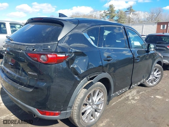 2021 Mazda CX-5 Grand Touring with VIN JM3KFBDM3M1318248, listed as a IAAI auction lot 41678260 with 71,903 mi miles. Bid and sale history available at carsss.com. Image 4.