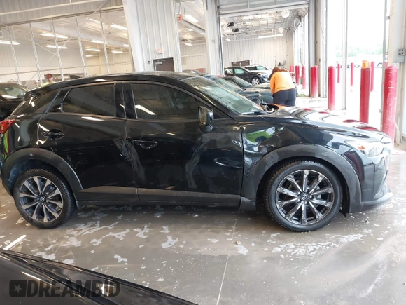 2019 Mazda CX-3 Touring z VIN JM1DKDC70K0404219, wystawiony jako IAAI lot #42148454 z przebiegiem 80 539 mil mil oraz . Historia ofert i sprzedaży dostępna na DreamBid. Obrazek 13.