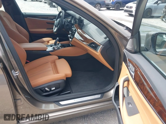 2018 BMW 5 Series 530i xDrive with VIN WBAJA7C55JG909519, listed as a IAAI auction lot 42650263 with 57,077 mi miles and . Bid and sale history available at DreamBid. Image 5.