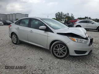 2018 Ford Focus SE with VIN 1FADP3F28JL256318, listed as a Copart auction lot 55524544 with 136,723 mi miles and Salvage title. Bid and sale history available at DreamBid. Image 4.