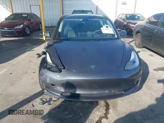 2023 Tesla Model 3 with VIN 5YJ3E1EA5PF697201, listed as a IAAI auction lot 41589422 with 16,862 mi miles and . Bid and sale history available at carsss.com. Image 12.