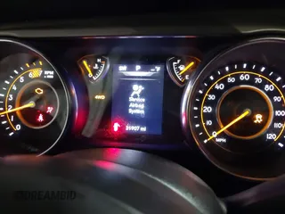 2021 Jeep Wrangler Sport S with VIN 1C4GJXAN7MW647786, listed as a IAAI auction lot 41685775 with 31,907 mi miles and . Bid and sale history available at DreamBid. Image 7.