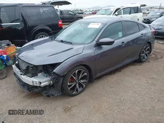 2018 Honda Civic Si z VIN 2HGFC1E59JH710458, wystawiony jako IAAI lot #42147386 z przebiegiem 89 650 mil mil oraz . Historia ofert i sprzedaży dostępna na DreamBid. Obrazek 2.