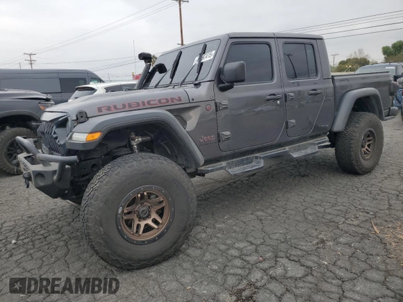 2021 Jeep Gladiator Rubicon with VIN 1C6JJTBG9ML512347, listed as a Copart auction lot 43197415 with 134,608 mi miles and Salvage title. Bid and sale history available at DreamBid. Image 1.