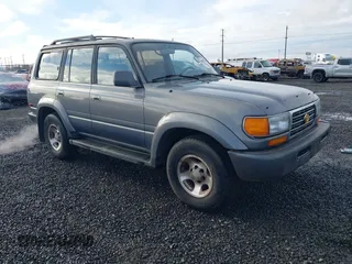 1995 Toyota Land Cruiser z VIN JT3DJ81W0S0094999, wystawiony jako IAAI lot #41583748 z przebiegiem 93 454 mil mil oraz . Historia ofert i sprzedaży dostępna na DreamBid. Obrazek 1.