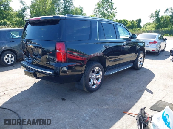 2015 Chevrolet Tahoe LTZ z VIN 1GNSKCKC3FR104845, wystawiony jako IAAI lot #42291785 z przebiegiem 75 047 mil mil oraz . Historia ofert i sprzedaży dostępna na DreamBid. Obrazek 4.