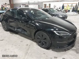 2022 Tesla Model S with VIN 5YJSA1E58NF478403, listed as a IAAI auction lot 41533099 with 42,779 mi miles. Bid and sale history available at carsss.com. Image 1.