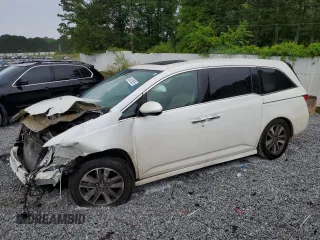 2015 Honda Odyssey Touring Elite z VIN 5FNRL5H90FB057629, wystawiony jako Copart lot #54176535 z przebiegiem Nie podano mil oraz Szkoda całkowita • Salvage title. Historia ofert i sprzedaży dostępna na DreamBid. Obrazek 1.