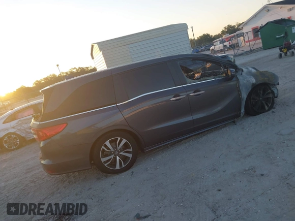 2023 Honda Odyssey Touring with VIN 5FNRL6H84PB053582, listed as a IAAI auction lot 42012108 with Not Provided miles and . Bid and sale history available at DreamBid. Image 4.