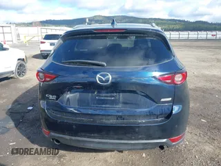 2019 Mazda CX-5 Signature with VIN JM3KFBEY5K0609063, listed as a IAAI auction lot 41802772 with 104,112 mi miles. Bid and sale history available at carsss.com. Image 17.