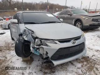 2014 Scion tC with VIN JTKJF5C71E3067326, listed as a IAAI auction lot 41346333 with 144,732 mi miles. Bid and sale history available at carsss.com. Image 1.