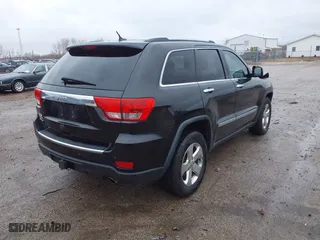2013 Jeep Grand Cherokee Limited with VIN 1C4RJFBG4DC633137, listed as a IAAI auction lot 41235064 with 163,820 mi miles. Bid and sale history available at carsss.com. Image 4.