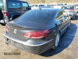 2013 Volkswagen CC Sport with VIN WVWBP7AN9DE565587, listed as a IAAI auction lot 41739505 with 167,319 mi miles. Bid and sale history available at carsss.com. Image 4.
