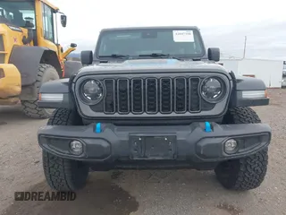 2024 Jeep Wrangler Rubicon z VIN 1C4RJXR67RW276710, wystawiony jako IAAI lot #42047318 z przebiegiem 35 857 mil mil oraz . Historia ofert i sprzedaży dostępna na DreamBid. Obrazek 12.