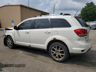 2012 Dodge Journey SXT with VIN 3C4PDCCG4CT243492, listed as a Copart auction lot 59908485 with 319,175 mi miles and Salvage title. Bid and sale history available at DreamBid. Image 2.