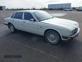 1989 Jaguar XJ with VIN SAJHY1541KC567978, listed as a IAAI auction lot 42153607 with 74,202 mi miles and . Bid and sale history available at DreamBid. Image 1.