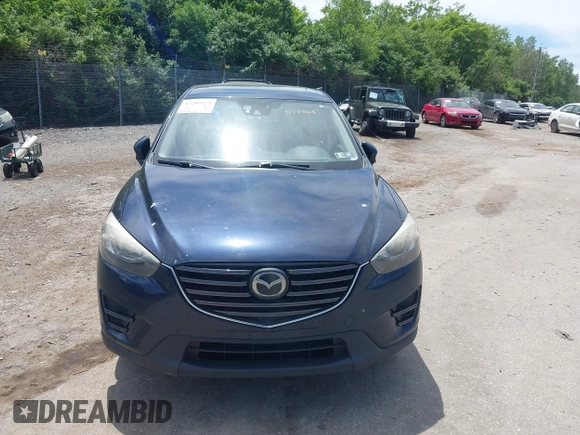 2016 Mazda CX-5 Grand Touring z VIN JM3KE4DY1G0817562, wystawiony jako IAAI lot #42289929 z przebiegiem 135 476 mil mil oraz . Historia ofert i sprzedaży dostępna na DreamBid. Obrazek 12.