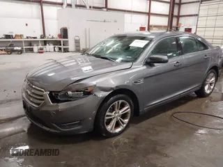 2013 Ford Taurus SEL with VIN 1FAHP2E86DG177504, listed as a IAAI auction lot 42071852 with 130,547 mi miles and . Bid and sale history available at carsss.com. Image 2.