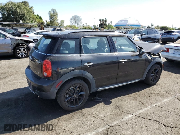 2016 MINI Countryman with VIN WMWZB3C58GWR47074, listed as a Copart auction lot 57174885 with 83,062 mi miles and Salvage title. Bid and sale history available at DreamBid. Image 3.