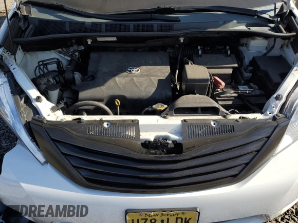 2014 Toyota Sienna L с VIN 5TDZK3DC5ES451825, выставлен на аукционе Copart как лот 79619074 с пробегом 151 146 миль миль и Списание • Salvage title. История ставок и продаж доступна на DreamBid. Изображение 13.
