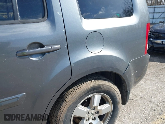 2011 Honda Pilot EX-L with VIN 5FNYF4H51BB065906, listed as a IAAI auction lot 41956370 with 233,977 mi miles and . Bid and sale history available at DreamBid. Image 18.