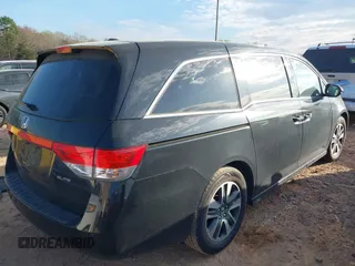 2014 Honda Odyssey Touring with VIN 5FNRL5H90EB077054, listed as a IAAI auction lot 41904456 with 197,869 mi miles and . Bid and sale history available at carsss.com. Image 4.