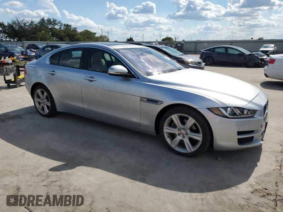 2017 Jaguar XE with VIN SAJAD4BN8HA970405, listed as a Copart auction lot 69598694 with 111,865 mi miles and Salvage Title. Bid and sale history available at DreamBid. Image 4.