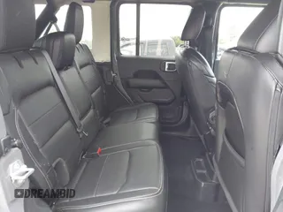 2022 Jeep Wrangler Unlimited Sahara with VIN 1C4HJXEG7NW138105, listed as a IAAI auction lot 42146898 with Not provided miles and . Bid and sale history available at DreamBid. Image 8.