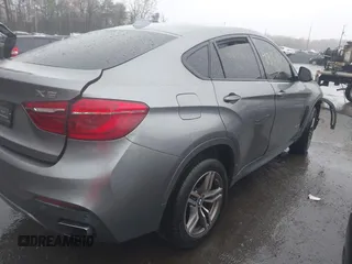 2017 BMW X6 xDrive50i with VIN 5UXKU6C56H0S99611, listed as a IAAI auction lot 41973292 with 117,123 mi miles. Bid and sale history available at carsss.com. Image 4.