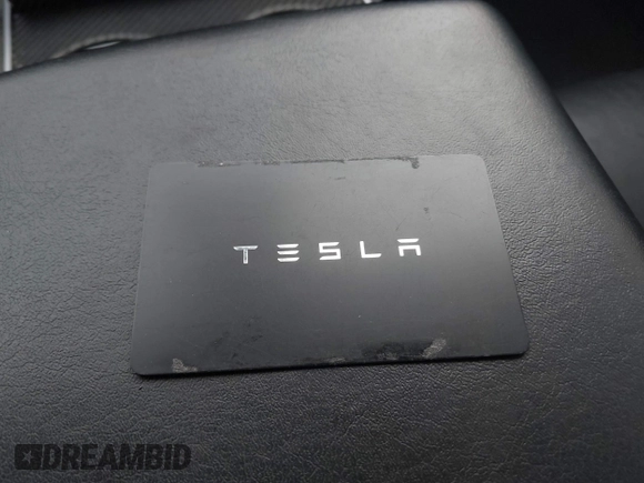 2019 Tesla Model 3 Mid Range with VIN 5YJ3E1EA8KF472540, listed as a IAAI auction lot 41661312 with 75,575 mi miles and . Bid and sale history available at DreamBid. Image 11.