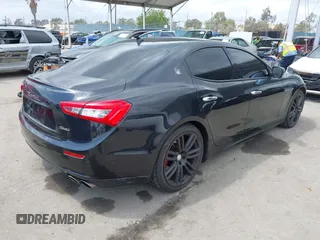 2014 Maserati Ghibli S Q4 with VIN ZAM57RTA0E1101059, listed as a IAAI auction lot 42121292 with 107,901 mi miles and . Bid and sale history available at DreamBid. Image 4.