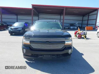 2017 Chevrolet Silverado 1500 LT with VIN 3GCUKREC5HG407502, listed as a IAAI auction lot 42013284 with 79,638 mi miles and . Bid and sale history available at DreamBid. Image 12.