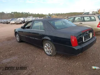 2002 Cadillac DeVille DTS with VIN 1G6KF57992U219921, listed as a IAAI auction lot 41261360 with 127,710 mi miles. Bid and sale history available at carsss.com. Image 3.
