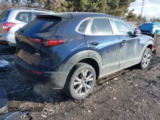 2020 Mazda CX-30 Select with VIN 3MVDMBCL9LM126154, listed as a IAAI auction lot 41492799 with 51,977 mi miles and . Bid and sale history available at DreamBid. Image 4.