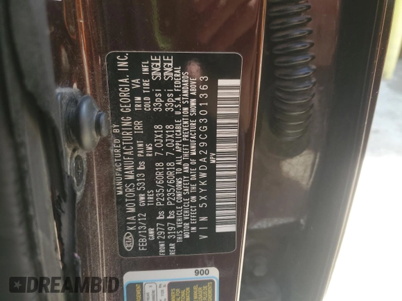 2012 Kia Sorento SX z VIN 5XYKWDA29CG301363, wystawiony jako Copart lot #55954815 z przebiegiem 83 206 mil mil oraz Szkoda całkowita • Salvage title. Historia ofert i sprzedaży dostępna na DreamBid. Obrazek 13.