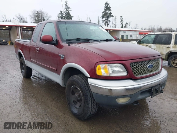 1999 Ford F-150 XL with VIN 2FTRX18L1XCA54790, listed as a IAAI auction lot 41556984 with 257,673 mi miles. Bid and sale history available at carsss.com. Image 1.
