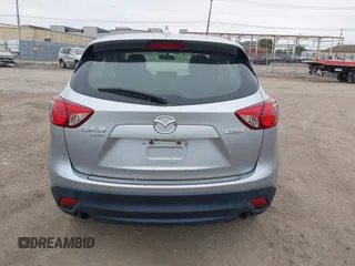 2016 Mazda CX-5 Sport z VIN JM3KE4BY1G0711602, wystawiony jako IAAI lot #42537627 z przebiegiem Nie podano mil oraz . Historia ofert i sprzedaży dostępna na DreamBid. Obrazek 16.