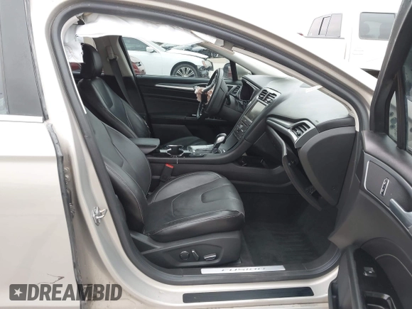 2016 Ford Fusion Titanium Hybrid with VIN 3FA6P0RU9GR143203, listed as a IAAI auction lot 41332144 with 94,357 mi miles. Bid and sale history available at carsss.com. Image 5.