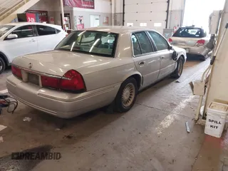 2000 Mercury Grand Marquis LS z VIN 2MEFM75W0YX736324, wystawiony jako IAAI lot #41865927 z przebiegiem 136 886 mil mil oraz . Historia ofert i sprzedaży dostępna na DreamBid. Obrazek 4.