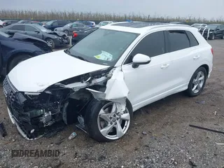 2020 Audi Q3 Premium with VIN WA1AECF35L1030273, listed as a IAAI auction lot 42006553 with 81,944 mi miles. Bid and sale history available at carsss.com. Image 2.