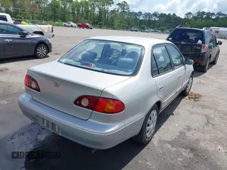 2002 Toyota Corolla CE with VIN 1NXBR12E12Z581660, listed as a IAAI auction lot 42654124 with 115,950 mi miles and . Bid and sale history available at DreamBid. Image 4.