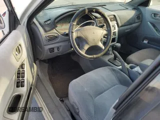 2003 Mitsubishi Galant ES z VIN 4A3AA46G43E124340, wystawiony jako Copart lot #74021014 z przebiegiem 220 226 mil mil oraz Szkoda całkowita • Salvage title. Historia ofert i sprzedaży dostępna na DreamBid. Obrazek 8.