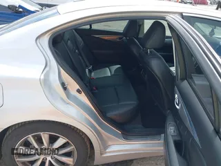2014 Infiniti Q50 Premium z VIN JN1BV7AP9EM690381, wystawiony jako IAAI lot #41761562 z przebiegiem 107 099 mil mil oraz . Historia ofert i sprzedaży dostępna na DreamBid. Obrazek 8.