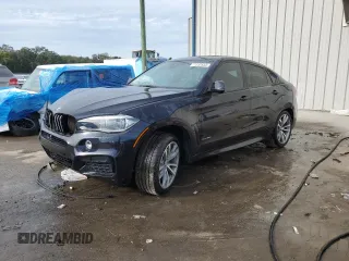 2015 BMW X6 xDrive50i with VIN 5UXKU6C56F0F93641, listed as a Copart auction lot 77233553 with 71,409 mi miles. Bid and sale history available at carsss.com. Image 1.