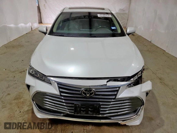 2021 Toyota Avalon XLE z VIN 4T1AZ1FB0MU060010, wystawiony jako Copart lot #56844085 z przebiegiem 115 788 mil mil oraz Czysty tytuł • Clean title. Historia ofert i sprzedaży dostępna na DreamBid. Obrazek 5.