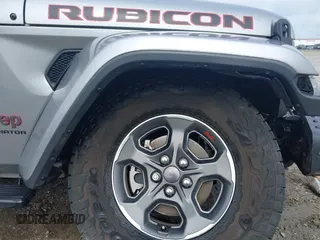 2020 Jeep Gladiator Rubicon z VIN 1C6JJTBG7LL181833, wystawiony jako IAAI lot #42493073 z przebiegiem 13 775 mil mil oraz . Historia ofert i sprzedaży dostępna na DreamBid. Obrazek 17.