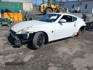 2014 Nissan 370Z with VIN JN1AZ4EH8EM634403, listed as a IAAI auction lot 41923568 with 137,676 mi miles. Bid and sale history available at carsss.com. Image 2.